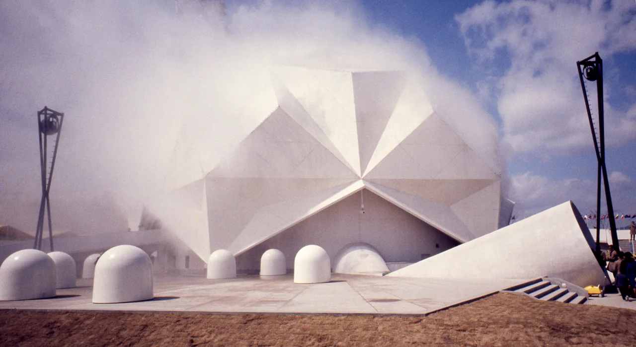 Fog passes over the faceted Pepsi Pavilion at Expo ’70, with Robert Breer’s white floats on the plaza.